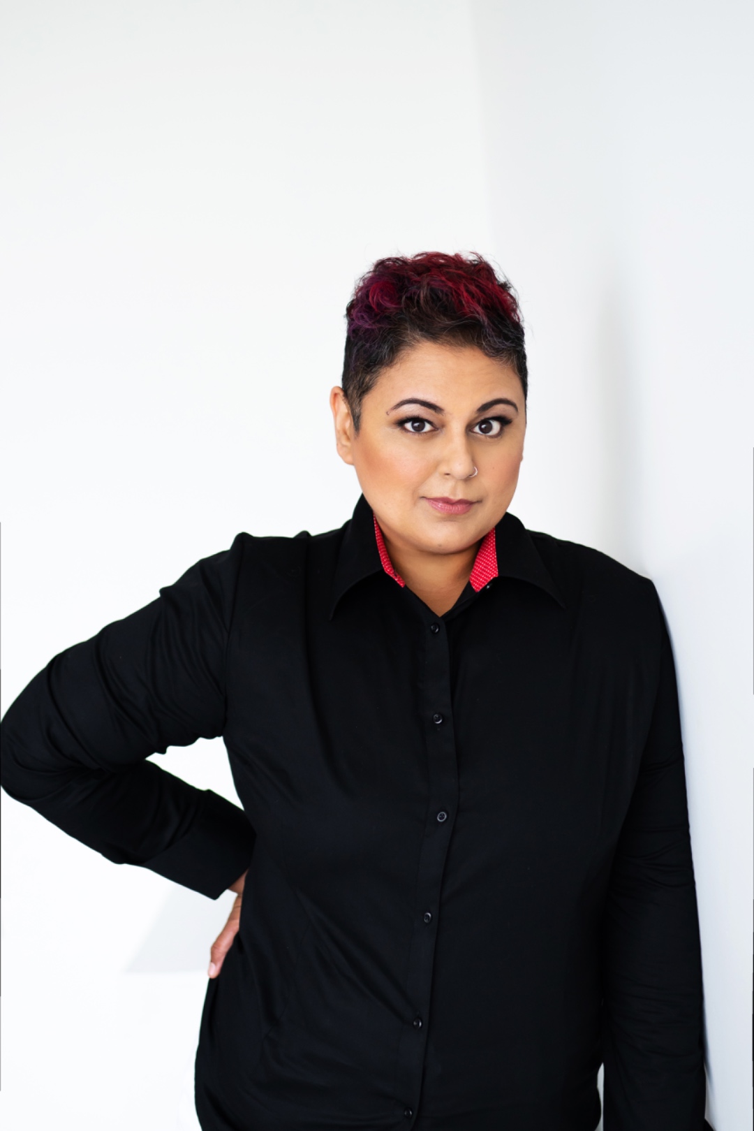 Farah in a direct, confident headshot